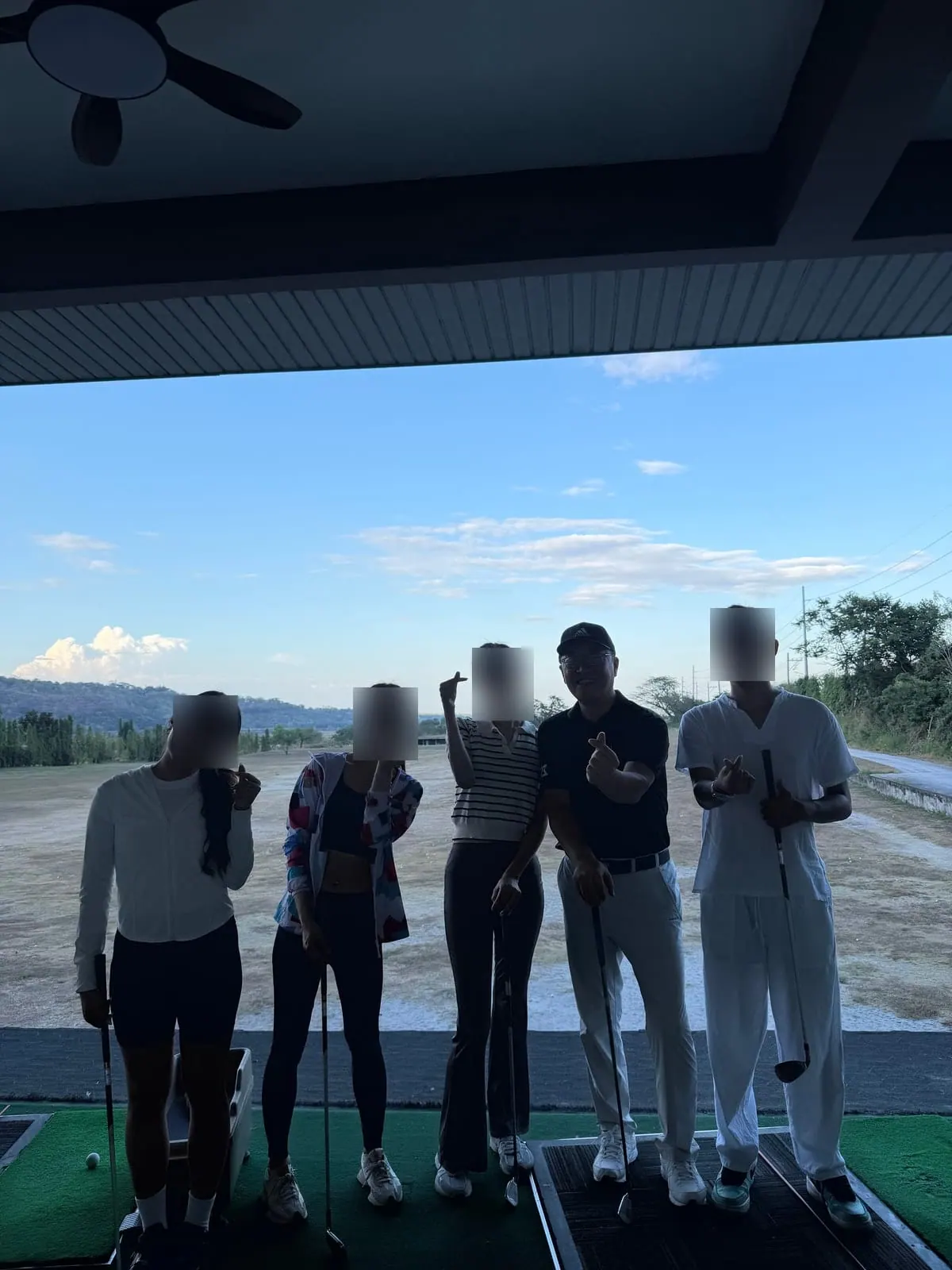 Students and the teaching pro after a golf lesson