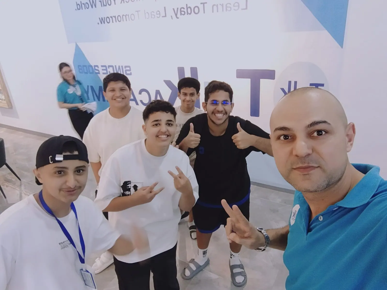 Abdullah with his Saudi classmates and a chaperone in the school lobby
