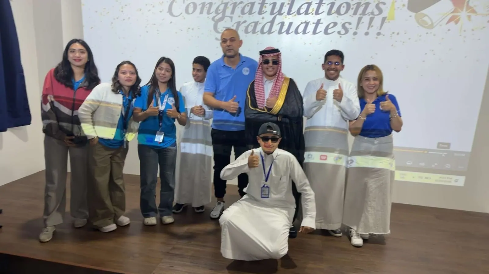 Saudi students and school staff at the graduation ceremony