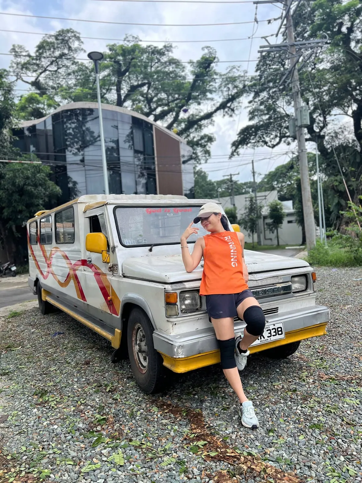 A student standing beside a jeepney in Clark